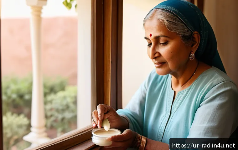 방사선 치료를 받는 환자 후기 - A middle-aged South Asian woman in modest, loose-fitting clothing, gently applying moisturizing crea...